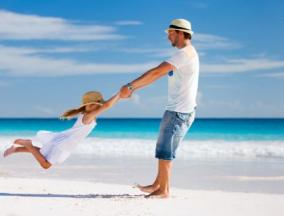 man on vacation playing with a child